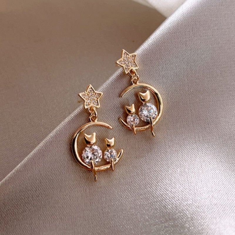 Gold earrings with cat family
