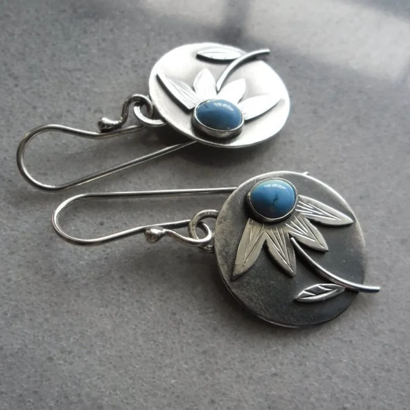 Vintage silver earrings with flower and blue stone