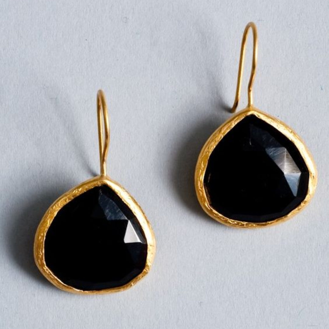 Vintage gold earrings with a large black stone