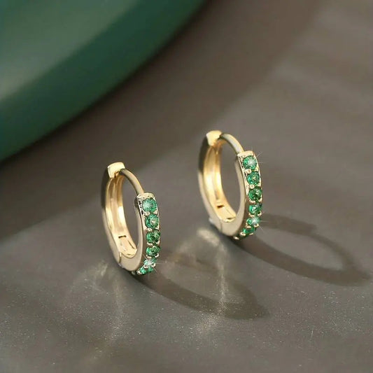 Elegant earrings with green cubic zirconia as inlay
