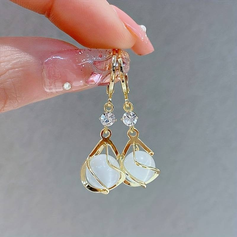 Earrings with white opal